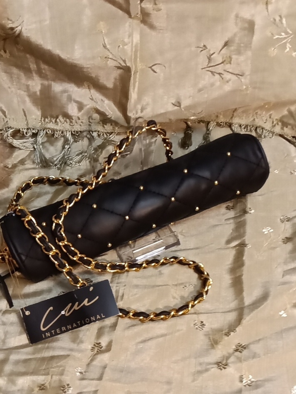 Black Quilted Cylinder Shoulder Bag with Gold Chain